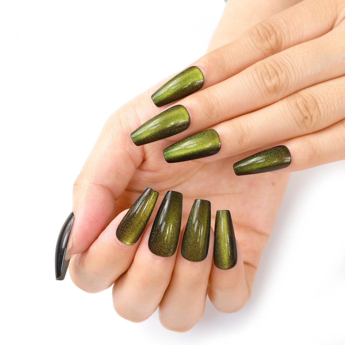 Hands showcasing long coffin-shaped press-on nails in green cat eye color against a white background