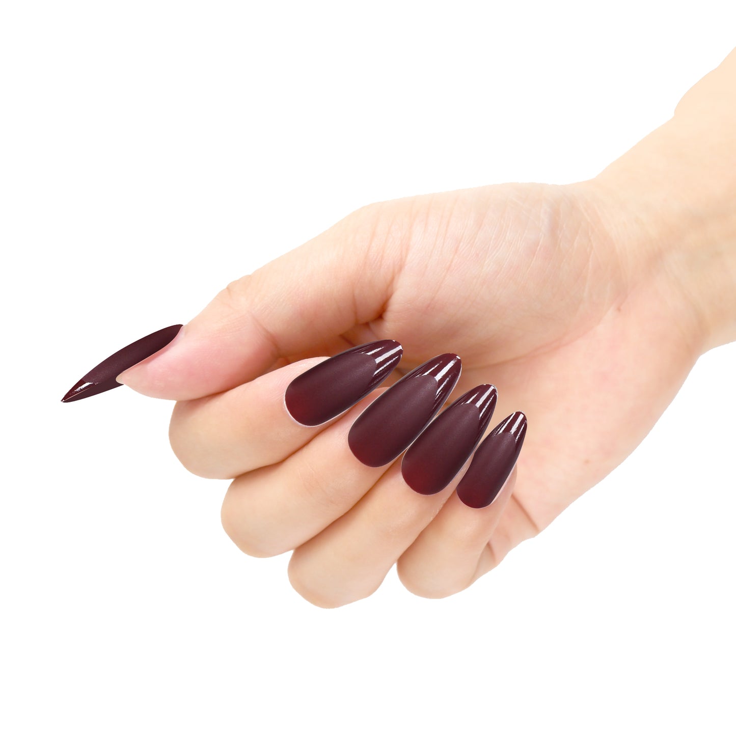 A hand featuring almond-shaped press-on nails in matte maroon with glossy tips on a white background.