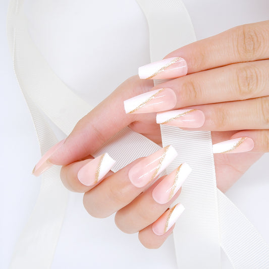 Fingers with Long coffin-shaped press-on nails in pink and white hues holding a white ribbon against a white background